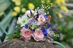 Summer bridal bouquet with cornflowers, peonies