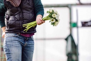 Walking with a bunch of white anemones