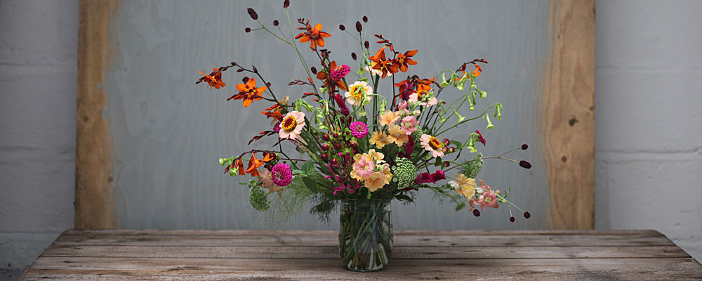 Seasonal flowers in a jar